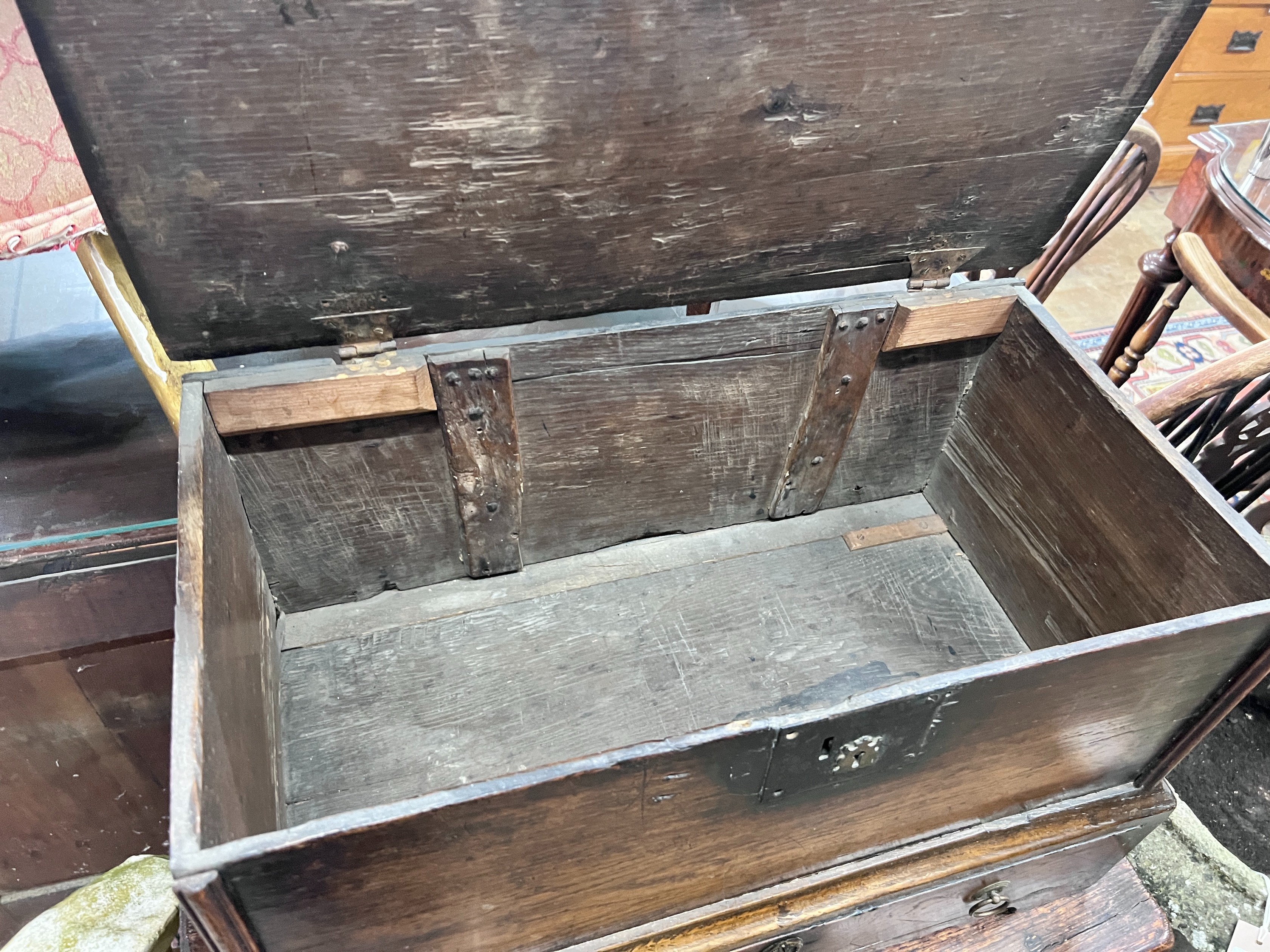 A small early 18th century oak mule chest, width 64cm, depth 34cm, height 42cm *Please note the sale commences at 9am.